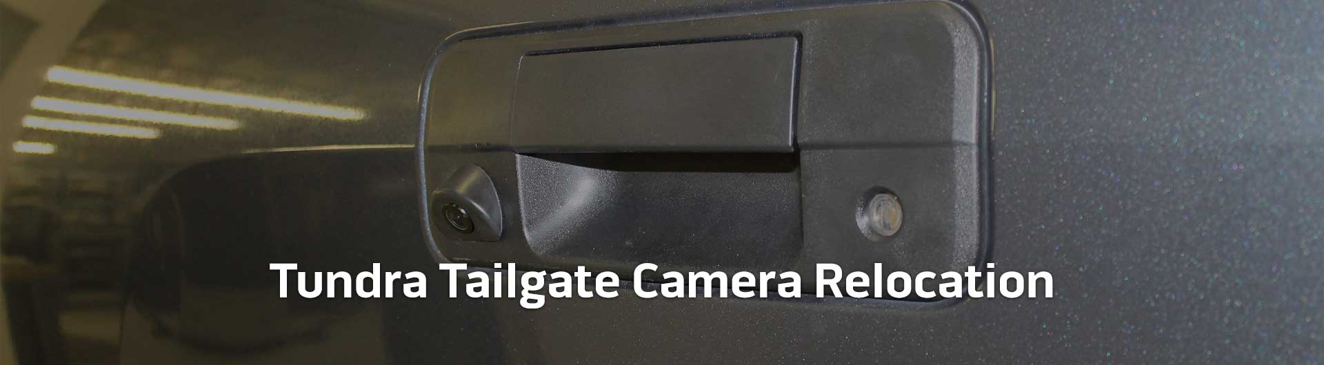 An image showing the tailgate handle camera of a Toyota Tundra. The image has text that reads Toyota Tundra Tailgate Camera Relocation.